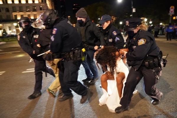 NYPD arresting woman at protest